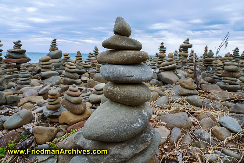rocks,piles,beach,tourists,gazillion,lots,millions,